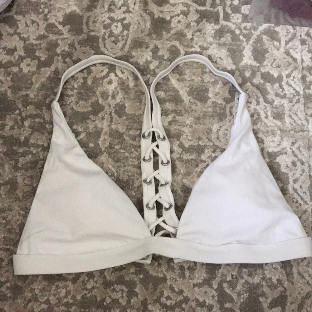 Passing white bathing suit top